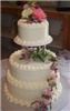 Truffle Trolley, Peoria — All of our cakes are created fresh the day before your function, they are NEVER frozen.  Our cakes are decorated by award winning Executive Pastry Chef Ted Anderson.  Floral arrangements are professionally created by Barbara, our on staff florist.  In addition to our fabulous cakes, we also have great truffle wedding and party favors.