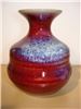 Gifted, Boston — Handmade mini pottery vases. Available in natural tans, sea green, black/brown, royal blue and reds. Also available in different shapes-votive holders, candle stands for pillar candles, creamers, mini bowls and more. Discount pricing for orders of 10 or more.