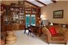 The Renaissance House, Glen Muse LLC, Ojai — Library with fireplace, extensive books and ladder.