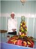 Scrumptious Suppers, LLC, Harrisonburg — Chef Vic standing by the fruit tree display