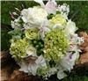 Snapdragon Studio, Vancouver — Traditional white hand-tied bride's bouquet. Flowers include hydrangea, roses, jasmine, orchid, snapdragons, and hypericum berries.
