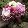 Snapdragon Studio, Vancouver — Pretty in pink! This bride's bouquet features orchids, roses, calla lillies, snapdragons, wax flower, and hydrangeas.