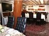 Yacht "America", San Diego — Luxury fine dining salon below decks for just 16 VIP guests. All other dining is on the main deck.