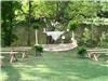 Alda's Magnolia Hill, Little Rock — A stone altar at the waters edge is perfect for a romantic ceremony. Guests are seated on hand-hewn cypress benches.