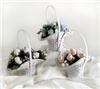 Baby Bootie Bouquet - New York, New York — A charming presentation of our trademarked rosebud socks arranged in a whtie wicker basket. Eight bootie blooms with baby’s breath can be unrolled for baby to use while mommy can enjoy the basket for a variety of needs! Makes a perfect centerpiece at baby showers too. Bud basket centerpiece price $15.75 (6 bootie blooms). Bud basket $25.00 8 bootie blooms with additional greenary.