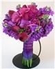 Sparks Florist, Sparks — Our richly colored Purple Romance hand-tied bouquet features freesia, tulips, roses, and fragrant stock in lavender, fuschia, and purple tones for your very special day.