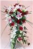Sparks Florist, Sparks — Our "Ever After" cascade bridal bouquet features an outstanding collection of superb white cymbidium orchid blossoms, long white dendrobium sprays, peppery white freesia, and red roses accented with long bear grass, Italian ruscus, and ming and leatherleaf ferns. Perfect for weddings with a tropical theme.