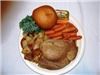 the MarketPlace Catering - Mitchell, Mitchell — Plated meal with our signature Roast Beef, Roasted/Parmesian Baby Reds, glazed Carrots, Dinner roll & butter.