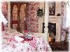 MoonStruck Manor B& B and Gift Shop, Gifts & Whimsey Shop at MoonStruck B&B, Syracuse — The "Ruby Room" will cheer and brighten your morning, and mellow and relax your evenings.
Decorated in a lush ruby toile, this room has a romantic French flair about it.  Private bath with shower and comfy four poster bed complete the sense of enchantment!
(If you're an early riser, the east window will delight you!)