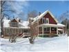 Pleasant Street Inn Bed & Breakfast, Rangeley — True country elegance in Rangeley Maine! We are within the village of Rangeley, walking distance to downtown and Rangeley Lake.  We offer five spacious bedrooms with two guest living rooms, we are sure you will find relaxing and welcoming. We offer a full country breakfast and ‘tea-time’. Each bedroom has queen, king or twin beds, a private bath, satellite TV, wired and wireless high speed internet access, individually zoned heat.  Some bedrooms have whirlpool tubs and Select Comfort beds.  We offer a computer onsite, a front casual living room with satellite TV and a second more formal living room with a gas fireplace, great for tea-time, visiting, or just curling up with a book. A guest self-serve refreshment area, a guest mudroom large enough to store recreational equipment, and a small library in case you forgot your book, are some other amenities that we offer at Pleasant Street Inn B&B.