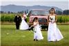 Enchanted Florist - Everett, Everett — Flower girls lead the way for the wedding on the farm.