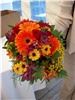 Enchanted Florist - Everett, Everett — Gerber daisys, viking mums, tansy, and asters were the stars of this bridal bouquet.