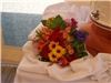 Enchanted Florist - Everett, Everett — The complimentary throw bouquet is placed next to the wedding cake.