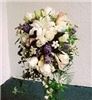 Enchanted Florist - Everett, Everett — The bridal bouquet was a symphony of fragrance.  The oriental lilies, stephanotis, and creamy white roses were accented with little touches of blue delphinium and lavender lisianthus.