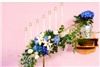 Enchanted Florist - Everett, Everett — Candlelabra bouquets add a bright touch of color to a very white and featureless church.