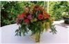 Enchanted Florist - Everett, Everett — The centerpieces were spilling over with lime green amaranthus, vibrantly orange and pink dahlias, roses, alstromeria and hypericum berries.  A little seeded eucalyptus added a softer silvery touch.