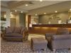 Howard Johnson Inn & Suites, Rapid City — Relax in our spacious lobby and enjoy the warm fireplace in the winter.