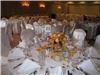 Entire Facility, Creative Catering Banquet Hall, Port Saint Lucie — You may bring in your own centerpiece, as shown in this picture or you may use our centerpieces which come standard with the room.  We have two choices.  A white vase with white roses or a glass hurricane vase with a candle in the center and white artificial flowers around the base.