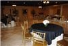Entire Facility, Elegant Memories, Greenwell Springs — Gold Chivari chairs, round, floor length table drapes and toppers with silk centerpieces are available for your use.