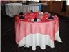 LinenTablecloth - Riverside, Riverside — Red Organza Overlay with 120" white round and black napkins.