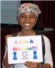 Education by Entertainment, Daytona Beach — Colleen M. Williams the Champion at an EduTainment program at Embry-Riddle Aeronautical University in November 2009 holding the "I Am A Winner" sign. This photo appeared in the university news paper.