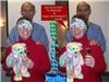 Education by Entertainment, Daytona Beach — Happy Birthday Sign/Card made from pictures taken at one of my EduTainment Programs.  While this card was made several years ago it remains one of my favorites.  Documentation and training (DocTrain) Outstanding Participant Jennifer Fregeolle (posing with me) is holding an outstanding performance trophy and Happy Birthday Bear with an Awesome ribbon.  She is blindfolded with a Happy Birthday bandanna. Her engagement ring is in perfect focus. Her facial expressions are perfect.  The combination just seems ideal for a birthday surprise souvenir from our program.