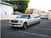 K and G Limousine Services Inc, New Hyde Park — It features a snow white exterior. The interior features Tu-tone beige & sky blue leather seats. It also features a disco light show, laser light show, strobe light, mirrored ceiling with twinkle lights, color changing neons. There is a 600 watt CD, DVD, VCR w/4 flat screen TV's and surround sound system. The bars offer a champagne cooler and multiple ice & beverage coolers, w/ all glassware. It has a solid divider, high capacity A/C system, extra luggage space