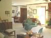 B&B Country Garden Inn, Apex — The rich dark paneling in this spacious area gives it a rustic quality which completes the country setting! Whether you are into cards, reading,conversing or watching movies, this is the ideal place to relax after a busy day!