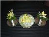 Annie's Orchids, Red Bank — Green Cymbidium orchids floating on crystals in a lighted bowl.