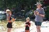 Entire Facility, Kingsley Pines, Raymond — A family enjoys the sun and relaxes on our natural sandy beach.