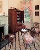 Homewood House Museum, Baltimore — Dressing Room

In addition to the Dressing Room's obvious function, this room could have also been used as a small sitting room for needlework, reading, or correspondence. A closet — about ten feet off the floor and accessible only by ladder — was used for seasonal storage. The painted floorcloth, in a pattern called "tumbling blocks" provided a durable floor covering that would have been significantly cooler than carpeting in the summer months.