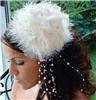 Fairytale Bridal Tiara, Miami — This vintage-inspired bridal hat is an enchanting alternative to a bridal veil. The piece features a feather base with a bow and three fabric roses on top. Faux pearls and rhinestones subtly sit at the center of the roses, and a spray of faux pearls dangle beautifully off of one side.