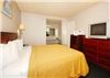 QUALITY INN NEAR LONG BEACH AIRPORT, Signal Hill — King Room: One California King Bed, Refrigerator, Microwave, Iron & Board, Blow Dryer, Coffee Maker. Free Wireless Internet Access.