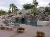 Mediterranean Mansion, Rancho Valle Milagro, Tucson — The rear of the residence is occupied by a full-length patio with a professional grill, natural rock pool, waterfalls and spa. Perfect for outdoor entertaining.
