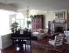 Mediterranean Mansion, Rancho Valle Milagro, Tucson — The large living room has comfortable furnishings and a baby grand player piano.