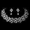 Portland's Treasure Chest, Portland — A striking pearl necklace and earring set showcasing a silver setting and delicate leaf design laden with gorgeous white faux pearls and encrusted with clear crystals. Matching earrings complete the set. This beautiful bridal set makes the perfect accessory for every special occasion.

Size: Necklace: (L) 24'', (Diameter) 4'', (Extender) 2.5'', Earrings: (H) 1.25'', (W).5''
  
This jewelry set generally mails out in 1-3 days from the warehouse