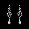 Portland's Treasure Chest, Portland — Stunning and vintage-inspired, these beautifully designed silver plated earrings are encrusted with sparkling Cubic Zirconias and topped off with a dangling freshwater pearl. A perfect accessory for your white wedding dress.

Earrings measure 2.25" long.