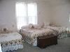 The Gathering Place, Sioux Falls — Our "Viola" room has two twin beds and one full size bed. The room also has a dressing table with mirror and nice size closet.