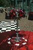 Flowers by Mary Beth Bartel, Portland — Silver candlelabara with flower ring of roses, alstroemaria, pansies, and feathers.