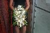 Flowers by Mary Beth Bartel, Portland — Cascading bridal bouquet of roses, stepanotis and wheat.