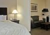 Comfort Inn and Suites Oklahoma City Airport, Oklahoma City — Spacious suite with sitting area
