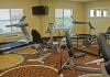 Comfort Inn and Suites Oklahoma City Airport, Oklahoma City — Fitness center with cardio equipment and weights