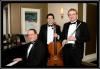 Mike Davis Trio, Traverse City — The Mike Davis Trio is one of the most popular music trios in Northern Michigan. The music trio is comprised of three outstanding professional musicians that perform as both a classical trio and a jazz trio. The classical trio includes flute/vocal, cello/bass, and piano. This combination of instruments, performing a wide variety of wedding classics, is ideal for wedding ceremonies. We can also provide vocals in several different styles from classical to pop ballads.

The same three talented musicians also perform as jazz trio on sax, bass and piano. The trio plays a wide variety of jazz styles including standards, swing, Latin, and contemporary. Our jazz trio is the perfect musical choice for cocktail hours, dinner receptions, and private parties. Mike is also a talented vocalist who can sing all the great jazz standards performed by Frank Sinatra, Tony Bennett, and others.