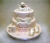 Confectionary Designs, Bogota — Baby shower cake with edible booties, clouds, and sugarpaste baby!