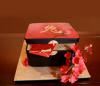 Confectionary Designs, Bogota — Chinese gift box cake with sugar cherry blossoms.