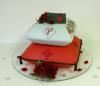 Confectionary Designs, Bogota — Bridal shower carved pillow cake with edible flowers. Cake designed using bride and groom's wedding invitation as inspiration.