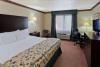 LaQuinta Inn Balch Springs, Mesquite — All spacious guest rooms and large suites feature well-lit workspaces, 27' television movie cable channels, in-room minifridge, microwave, coffee makers with free coffee, hair dryers, alarm clock radios, full size iron and ironing board.