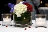 Joan Day Weddings, LLC, Columbia — The simple combination of a white hydrangea bloom, with an iris, and red carnation, created a lovely center piece adorning each cocktail table at a US Diplomatic reception.  Decor and catering direction, coordinated by Joan Day Kelley.