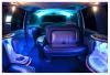 Jetz Limousine, Springfield — Inside view of the 20 passenger Ford Excursion limos light show. Other features include 3 LCD monitors, powerful sound system, CD/DVD/MP3 ready, laser light show, color changing strobes, colored neon changing LED bar lights, 3 separate mini bars and a VIP Section in back.