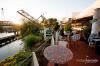 Patio, The Canal, Seattle — Custom Mosaic Tables overlook the majestic water view and iconic train bridge.
